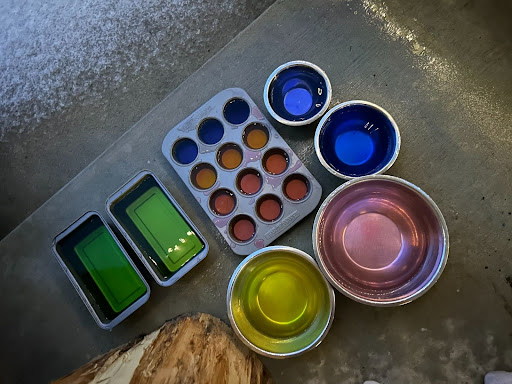 frozen colored water in muffin tins and baking pans
